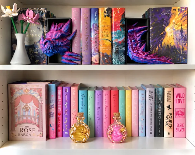 Fantasy bookshelves decorated with dragons and colorful potion bottles